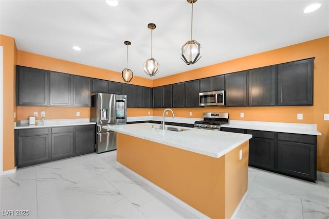 kitchen featuring a sink, marble finish floor, hanging light fixtures, and stainless steel appliances