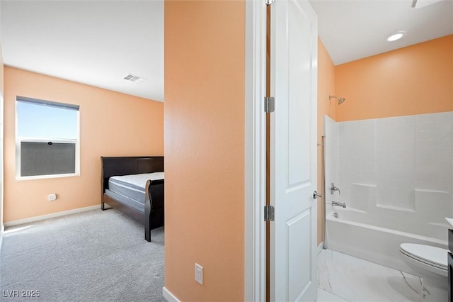 full bath featuring baseboards, bathtub / shower combination, toilet, and visible vents