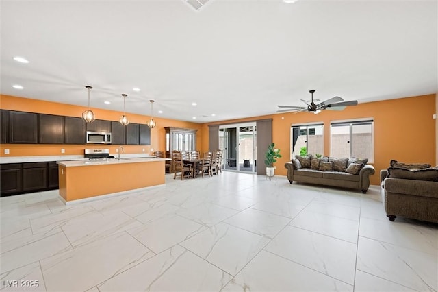 living area with recessed lighting, ceiling fan, visible vents, and marble finish floor