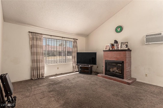 living area featuring a brick fireplace, an AC wall unit, a textured ceiling, carpet, and lofted ceiling