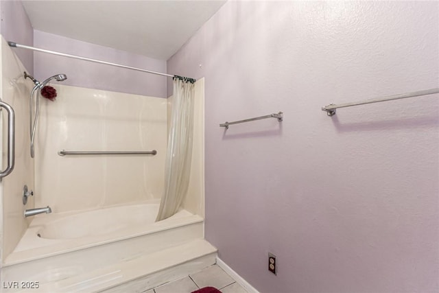 bathroom featuring tile patterned flooring and shower / bath combo with shower curtain