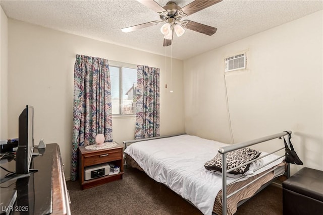 bedroom with carpet flooring, a ceiling fan, and a textured ceiling