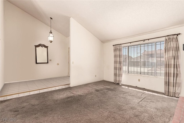 unfurnished living room with carpet floors and lofted ceiling
