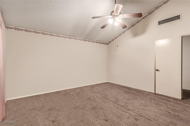 additional living space featuring visible vents, lofted ceiling, a textured ceiling, a ceiling fan, and carpet