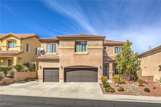 260 Pioneers Peak, Henderson, NV 89002 - mediterranean / spanish house featuring stucco siding, a garage, driveway, and a tile roof
