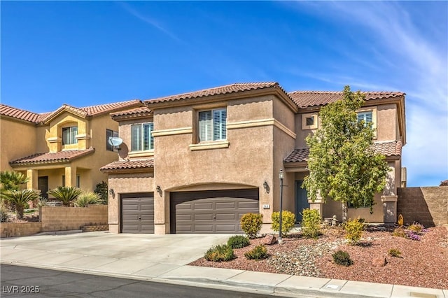 260 Pioneers Peak, Henderson, NV 89002 - mediterranean / spanish-style home featuring stucco siding, driveway, an attached garage, and a tiled roof