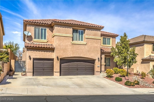 260 Pioneers Peak, Henderson, NV 89002 - mediterranean / spanish-style house with a gate, driveway, stucco siding, a garage, and a tile roof