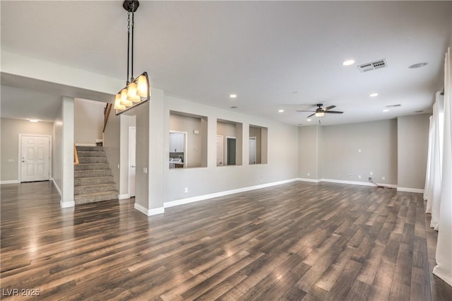 260 Pioneers Peak, Henderson, NV 89002 - unfurnished living room with dark wood-style floors, visible vents, stairway, and a ceiling fan