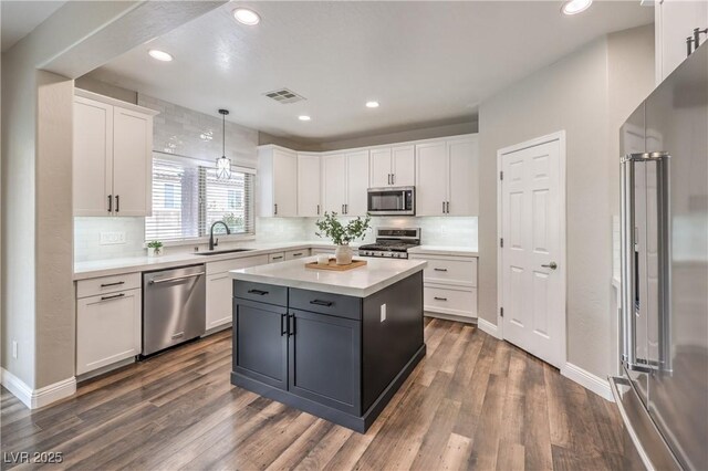 260 Pioneers Peak, Henderson, NV 89002 - kitchen with dark wood finished floors, white cabinets, visible vents, and stainless steel appliances