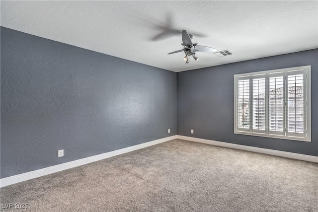 260 Pioneers Peak, Henderson, NV 89002 - empty room with visible vents, carpet, baseboards, ceiling fan, and a textured wall