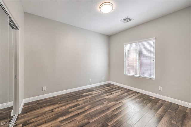 260 Pioneers Peak, Henderson, NV 89002 - spare room with visible vents, dark wood-style flooring, and baseboards