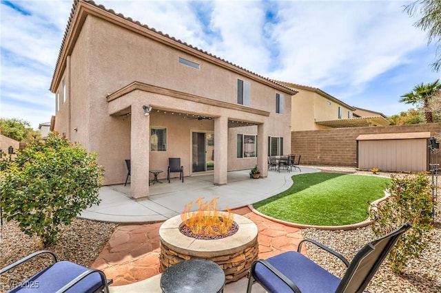260 Pioneers Peak, Henderson, NV 89002 - back of house featuring a patio area, stucco siding, an outdoor fire pit, and fence