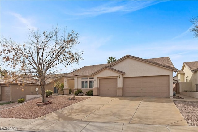 ranch-style home with driveway, stucco siding, a garage, and a tiled roof