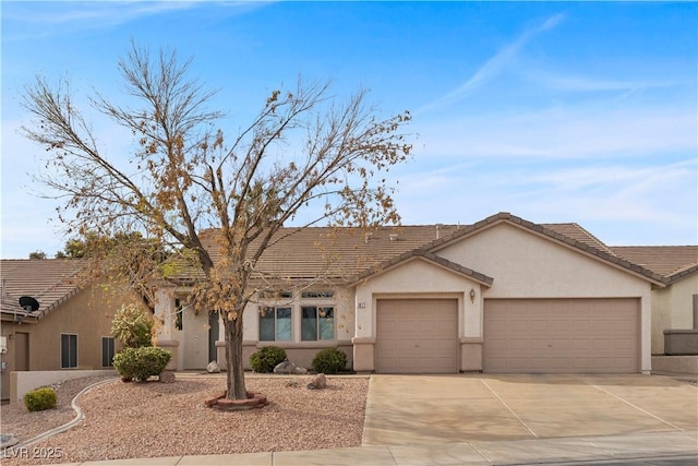 ranch-style home with stucco siding, driveway, a garage, and a tile roof