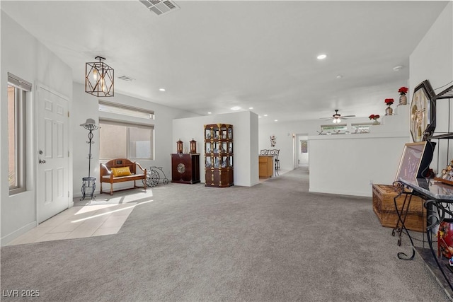 interior space featuring ceiling fan, visible vents, recessed lighting, and carpet