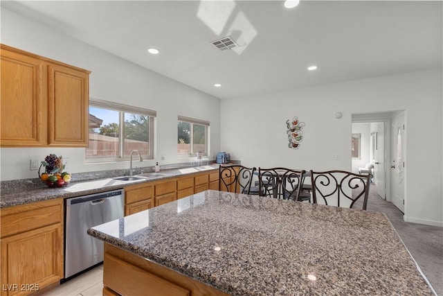 kitchen with recessed lighting, dark stone counters, a sink, visible vents, and dishwasher