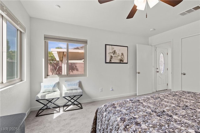 bedroom with baseboards, visible vents, ceiling fan, and carpet floors
