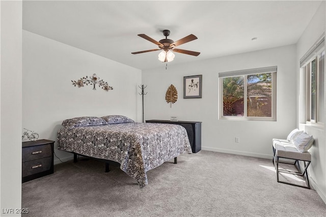 bedroom with carpet flooring, a ceiling fan, and baseboards
