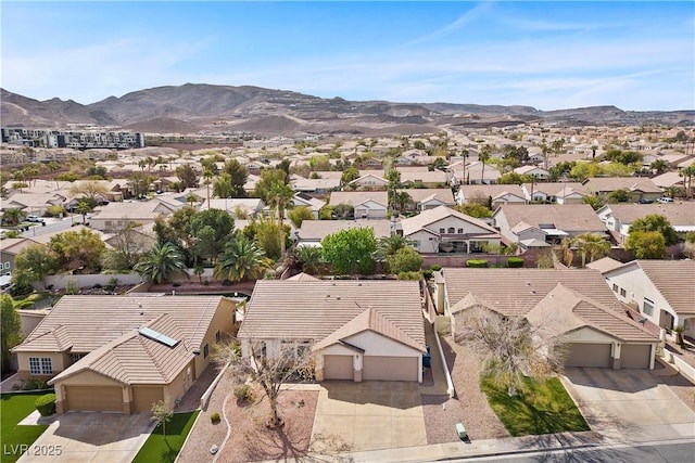 bird's eye view with a mountain view and a residential view