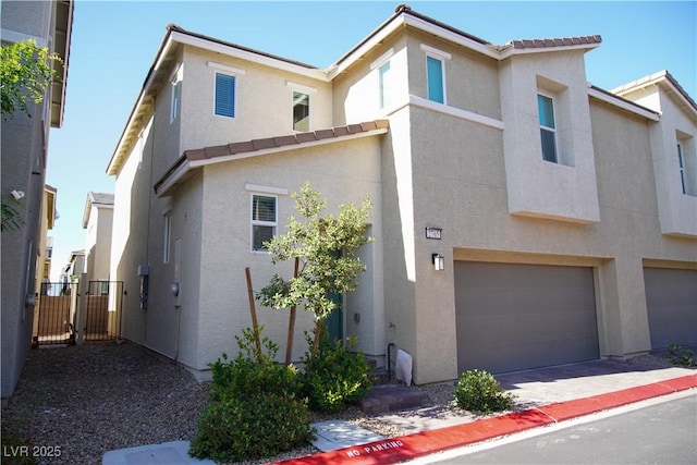 2765 Frosted Teal Ave, North Las Vegas, NV 89086 - townhome / multi-family property featuring stucco siding and a garage