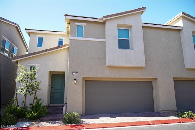 2765 Frosted Teal Ave, North Las Vegas, NV 89086 - view of property featuring stucco siding and an attached garage