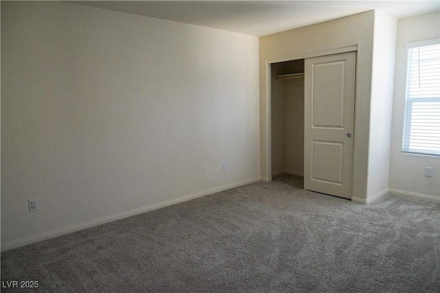 2765 Frosted Teal Ave, North Las Vegas, NV 89086 - unfurnished bedroom with carpet floors, multiple windows, baseboards, and a closet