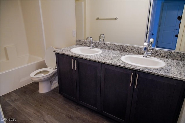 2765 Frosted Teal Ave, North Las Vegas, NV 89086 - full bathroom with wood finished floors, double vanity, toilet, and shower / tub combination