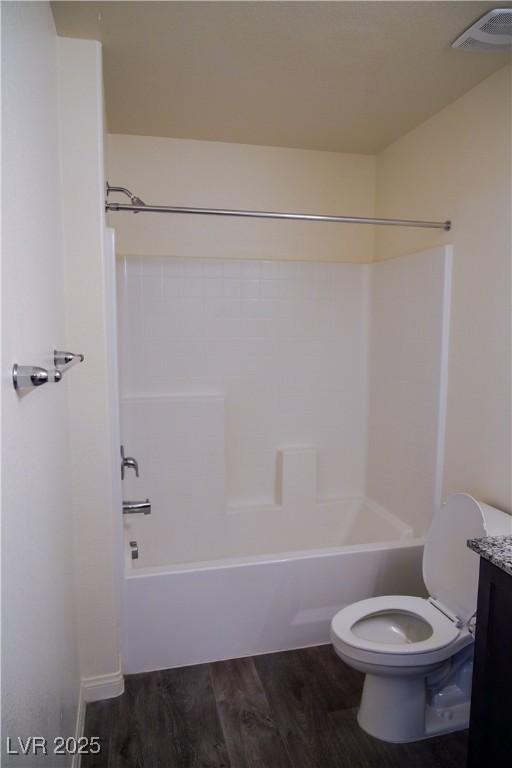2765 Frosted Teal Ave, North Las Vegas, NV 89086 - full bath with toilet, wood finished floors, washtub / shower combination, and vanity