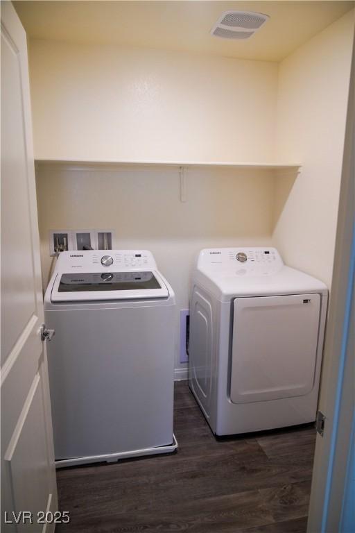 2765 Frosted Teal Ave, North Las Vegas, NV 89086 - laundry room with washing machine and dryer and dark wood-style flooring