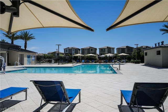 2765 Frosted Teal Ave, North Las Vegas, NV 89086 - community pool with a residential view and a patio