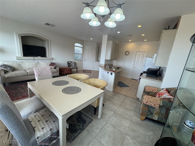 9126 Haddington Ln, Las Vegas, NV 89145 - dining room featuring light tile patterned floors, recessed lighting, a chandelier, and visible vents