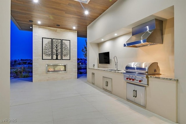 interior space with a fireplace, wall chimney range hood, wooden ceiling, and recessed lighting