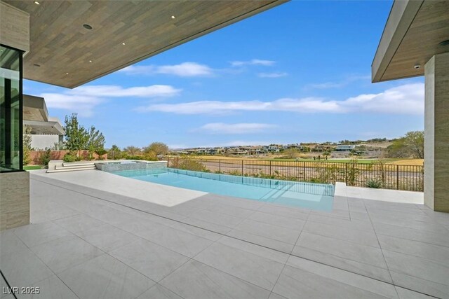view of swimming pool with fence, a patio, and a fenced in pool