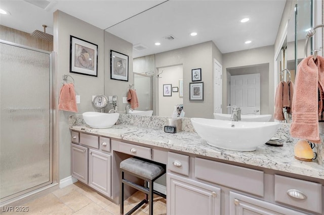full bathroom with a sink, recessed lighting, a shower stall, and double vanity