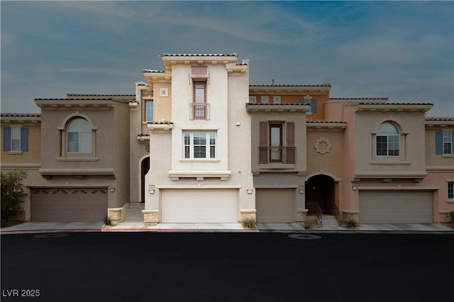 10091 Sand Key St, Las Vegas, NV 89178 - view of front of house featuring stucco siding, an attached garage, and a tiled roof
