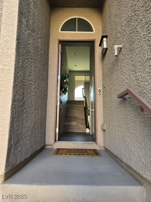 10091 Sand Key St, Las Vegas, NV 89178 - doorway to property with stucco siding
