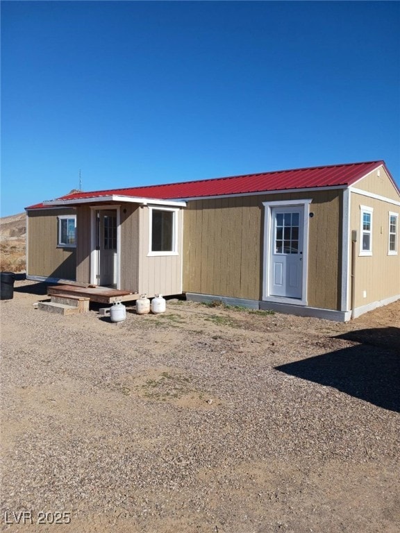 exterior space with metal roof