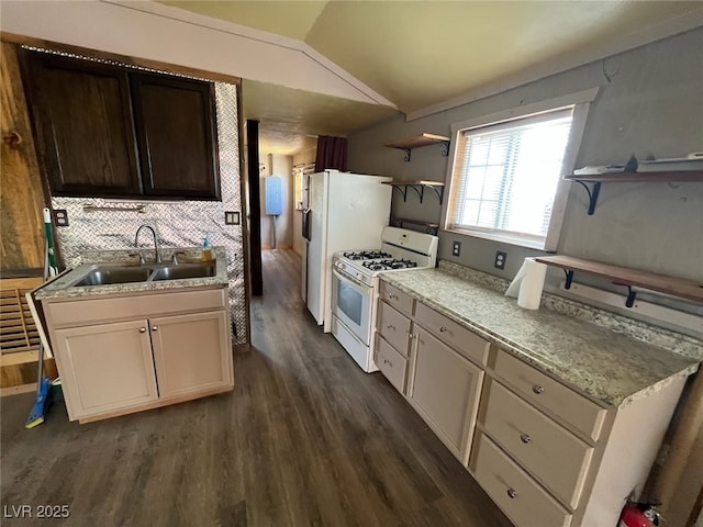 kitchen with white range with gas stovetop, dark wood-style flooring, lofted ceiling, a sink, and open shelves