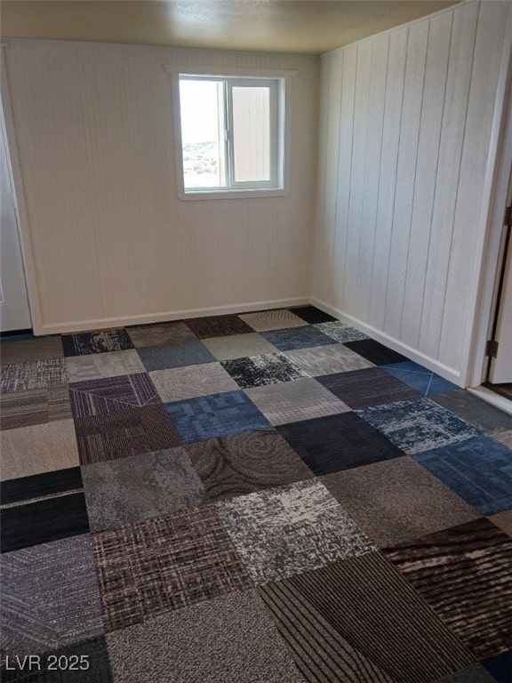 empty room with wood walls