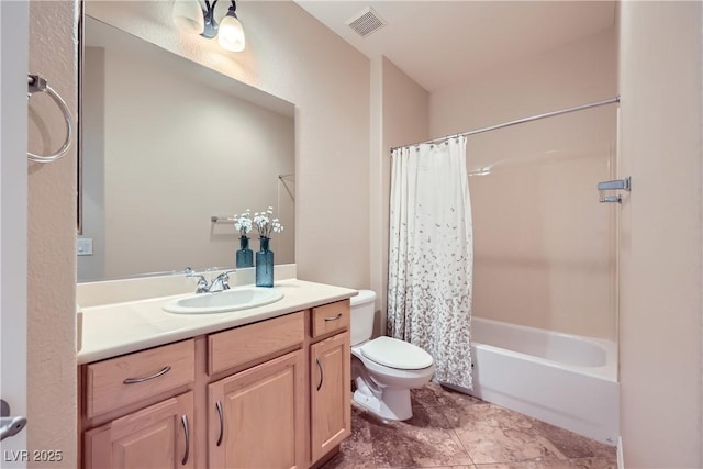 bathroom featuring vanity, toilet, visible vents, and shower / tub combo with curtain
