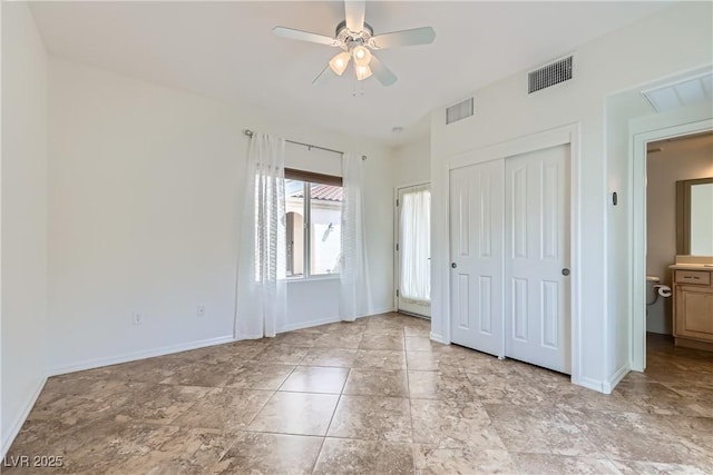unfurnished bedroom featuring baseboards, visible vents, a closet, and ceiling fan
