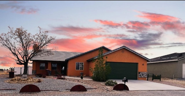 3424 Mount Charleston Dr, Pahrump, NV 89048 - single story home with a garage, driveway, stucco siding, and stone siding