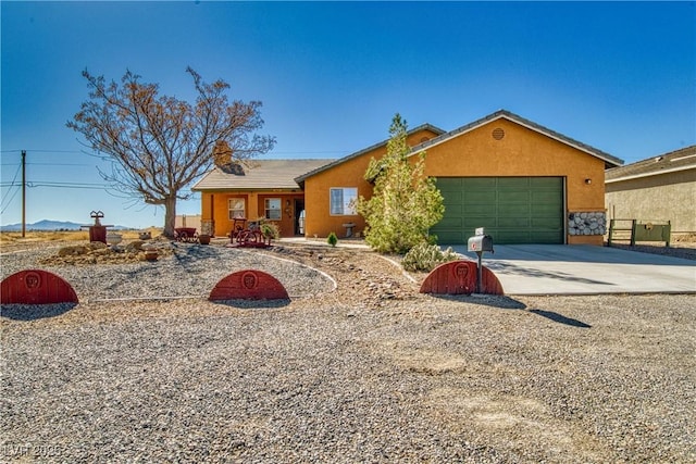 3424 Mount Charleston Dr, Pahrump, NV 89048 - ranch-style house with driveway, an attached garage, stucco siding, and a chimney