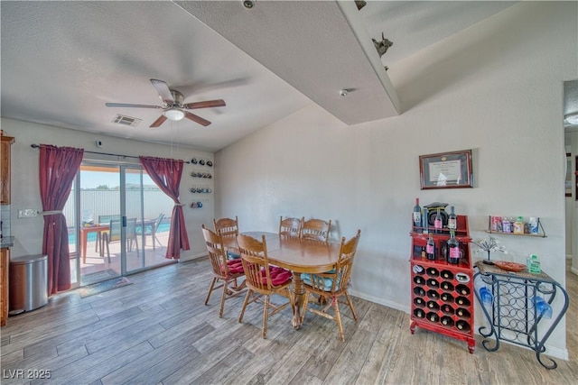 3424 Mount Charleston Dr, Pahrump, NV 89048 - dining space with ceiling fan, wood finished floors, a textured ceiling, and baseboards