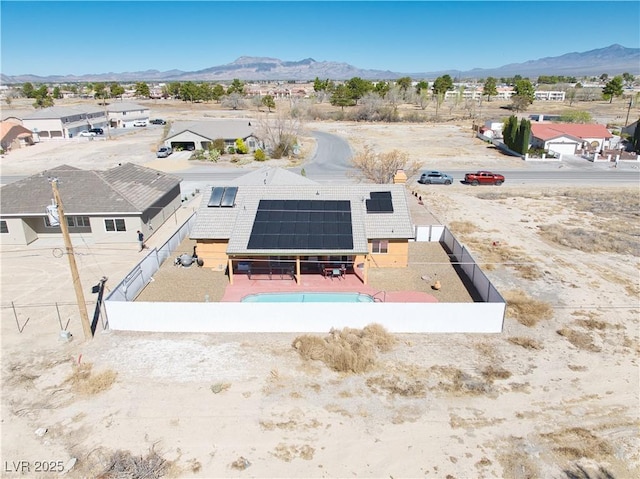 3424 Mount Charleston Dr, Pahrump, NV 89048 - aerial perspective of suburban area featuring a mountainous background