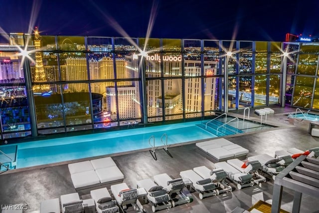 pool at night with a view of city lights