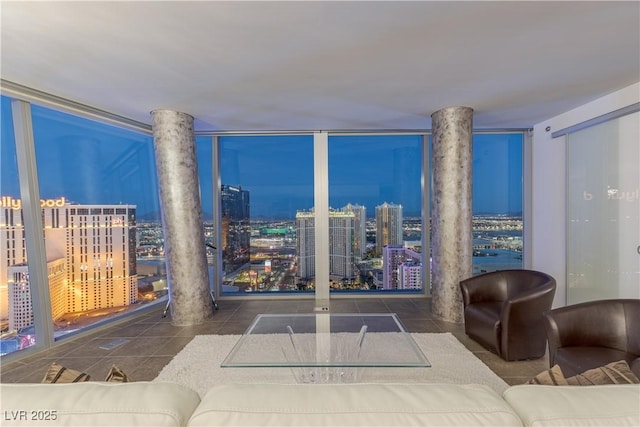 living room with a view of city and tile patterned flooring