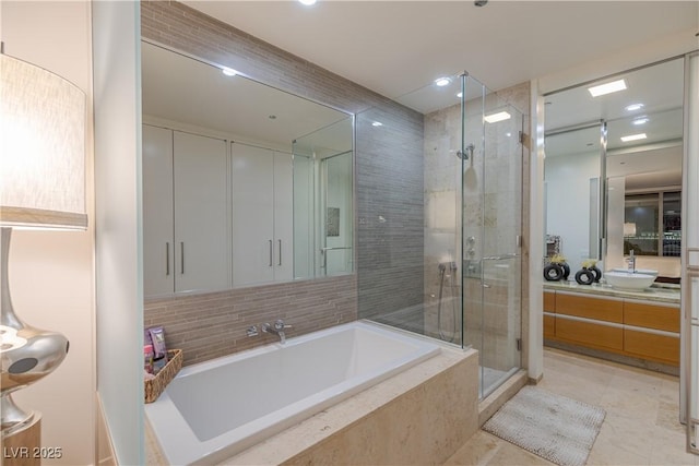 full bath with vanity, recessed lighting, tile patterned floors, a bath, and a shower stall