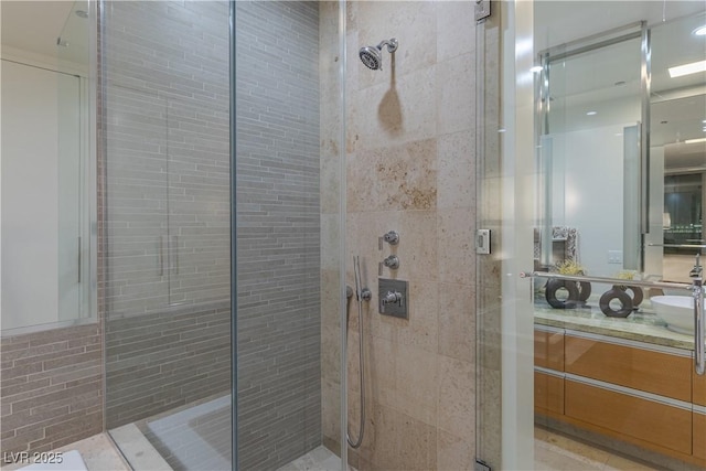 bathroom with vanity and a stall shower