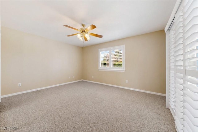 unfurnished room featuring carpet flooring, baseboards, and ceiling fan